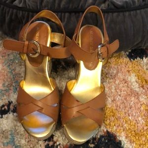 Tan, gold, and straw espadrilles.